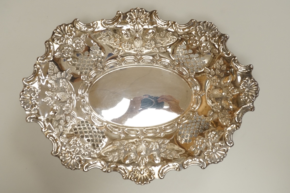 A late Victorian pierced silver oval dish, with shell and scroll border, by Ellis & Co, Birmingham, 1897, length 30.4cm, 10.5oz.